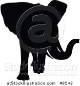 Vector Illustration of a Black Silhouetted Elephant by AtStockIllustration