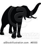 Vector Illustration of a Black Silhouetted Elephant by AtStockIllustration