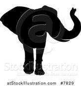 Vector Illustration of a Black Silhouetted Elephant Walking by AtStockIllustration