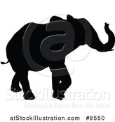 Vector Illustration of a Black Silhouetted Elephant Walking by AtStockIllustration