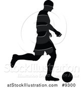 Vector Illustration of a Black Silhouetted Male Soccer Player in Action by AtStockIllustration