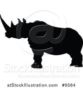 Vector Illustration of a Black Silhouetted Rhinoceros by AtStockIllustration