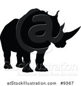 Vector Illustration of a Black Silhouetted Rhinoceros by AtStockIllustration
