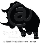 Vector Illustration of a Black Silhouetted Rhinoceros Charging by AtStockIllustration