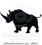 Vector Illustration of a Black Silhouetted Rhinoceros Charging by AtStockIllustration