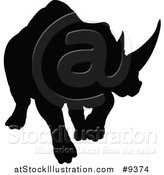 Vector Illustration of a Black Silhouetted Rhinoceros Charging by AtStockIllustration