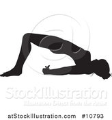 Vector Illustration of a Black Silhouetted Woman in a Yoga Pose by AtStockIllustration