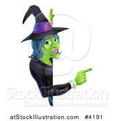 Vector Illustration of a Green Halloween Witch Pointing to a Sign by AtStockIllustration