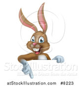 Vector Illustration of a Happy Brown Easter Bunny Rabbit Pointing down over a Sign by AtStockIllustration
