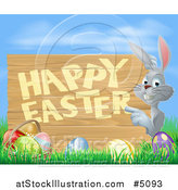 Vector Illustration of a Happy Gray Bunny Rabbit Pointing to a Happy Easter Sign over Eggs, Grass and Sky by AtStockIllustration
