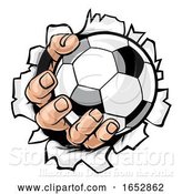 Vector Illustration of Cartoon Soccer Ball Hand Tearing Background by AtStockIllustration