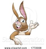 Vector Illustration of Easter Bunny Rabbit Character Peeking Sign by AtStockIllustration