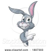 Vector Illustration of Easter Bunny Rabbit Character Peeking Sign by AtStockIllustration