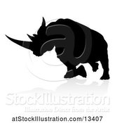 Vector Illustration of Silhouetted Charging Rhino with a Shadow on a White Background by AtStockIllustration
