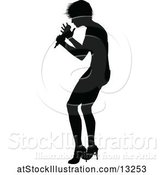 Vector Illustration of Silhouetted Female Singer by AtStockIllustration