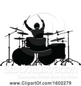 Vector Illustration of Silhouetted Male Drummer by AtStockIllustration