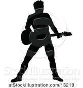 Vector Illustration of Silhouetted Male Guitarist by AtStockIllustration