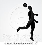 Vector Illustration of Silhouetted Male Soccer Player Heading a Ball over Gray, with Text Space by AtStockIllustration