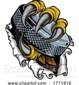 Vector Illustration of Tearing Ripping Claw Talons with Ice Hockey Puck by AtStockIllustration