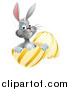 Vector Illustration of a Happy Gray Easter Bunny Sitting in a Gold and Yellow Egg Shell by AtStockIllustration