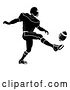 Vector Illustration of Silhouetted Football Player Kicking by AtStockIllustration