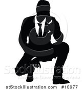 Vector Illustration of a Black and White Silhouetted Business Man Crouching by AtStockIllustration