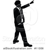 Vector Illustration of a Black and White Silhouetted Business Man Pointing by AtStockIllustration