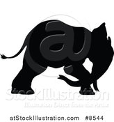 Vector Illustration of a Black Silhouetted Elephant by AtStockIllustration