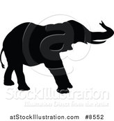 Vector Illustration of a Black Silhouetted Elephant by AtStockIllustration