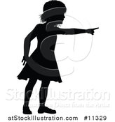 Vector Illustration of a Black Silhouetted Girl Pointing by AtStockIllustration