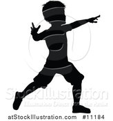 Vector Illustration of a Black Silhouetted Little Boy by AtStockIllustration