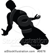 Vector Illustration of a Black Silhouetted Male Soccer Player in Action by AtStockIllustration