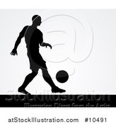Vector Illustration of a Black Silhouetted Male Soccer Player Kicking over Gray by AtStockIllustration
