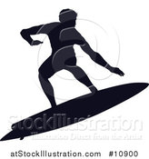 Vector Illustration of a Black Silhouetted Man Surfing by AtStockIllustration