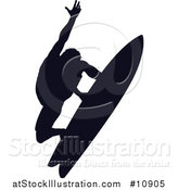 Vector Illustration of a Black Silhouetted Man Surfing by AtStockIllustration