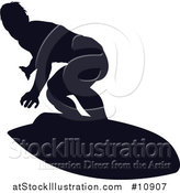 Vector Illustration of a Black Silhouetted Man Surfing by AtStockIllustration