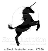 Vector Illustration of a Black Silhouetted Rearing Unicorn in Profile, Facing Right by AtStockIllustration