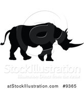 Vector Illustration of a Black Silhouetted Rhinoceros by AtStockIllustration