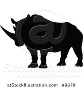 Vector Illustration of a Black Silhouetted Rhinoceros by AtStockIllustration