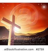 Vector Illustration of a Christian Cross Against a Sunset and Mountains by AtStockIllustration