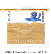 Vector Illustration of a Christmas Robin with a Santa Hat Pointing over a Snow Covered Wooden Sign by AtStockIllustration