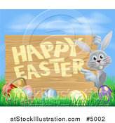 Vector Illustration of a Gray Bunny Pointing to a Happy Easter Sign, with Easter Eggs in Grass Against Blue Sky by AtStockIllustration