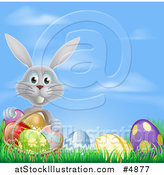 Vector Illustration of a Gray Bunny with a Basket and Easter Eggs in Grass by AtStockIllustration