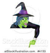 Vector Illustration of a Green Halloween Witch Wearing a Hat and Pointing down at a Sign by AtStockIllustration