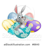 Vector Illustration of a Happy Gray Easter Bunny Sitting and Pointing from an Egg Shell by AtStockIllustration