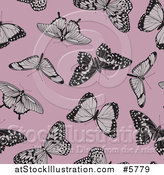 Vector Illustration of a Seamless Background Pattern of Butterflies on Pink by AtStockIllustration