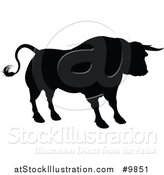 Vector Illustration of a Silhouetted Black Bull by AtStockIllustration