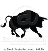 Vector Illustration of a Silhouetted Black Bull Charging by AtStockIllustration