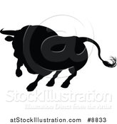 Vector Illustration of a Silhouetted Black Bull Charging by AtStockIllustration