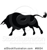 Vector Illustration of a Silhouetted Black Bull Charging by AtStockIllustration